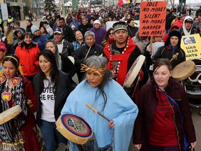 Following the closing ceremonies of the seventh and final Truth and Reconciliation Commission (TRC) event, participants march from the Shaw Conference Centre along Jasper Avenue to the Alberta Legislature on Sunday. DAVID BLOOM/Edmonton Sun