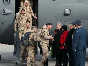 PM Stephen Harper, Gov. Gen. David Johnston and Gen. Tom Lawson welcome home Canadian soldiers from Afghanistan in Ottawa, Tuesday, March 18, 2014. (Tony Caldwell/QMI Agency)