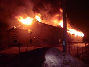 Flames engulf a Quinte West public works garage at 96 Wolfe St. in Frankford, Ont. around 2 a.m. Monday, March 31, 2014. Fire officials says the garage and "several" city trucks were destroyed in the overnight blaze. - SUBMITTED PHOTO