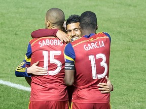 Real Salt Lake forward Alvaro Saborio (15), forward Olmes Garcia (13) and midfielder Javier Morales (center) celebrate a goal by Saborio during the second half against Toronto FC at Rio Tinto Stadium. (Russ Isabella-USA TODAY Sports)