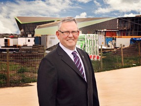 Ward 4 City Councillor Ed Gibbons stands outside a construction site in Edmonton's northeast.