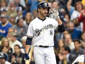 Milwaukee Brewers left fielder Ryan Braun (8) reacts to fans before his first at bat in the first inning against the Atlanta Braves of an opening day baseball game at Miller Park on Mar 31, 2014 in Milwaukee, WI, USA. (Benny Sieu/USA TODAY Sports)