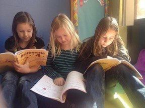 Grade 4 students Jalyn Jackson, Jamieson Smith and Elise Daichendt read at Temple Christian Academy. Members of Temple Baptist Church voted Sunday to close the long-standing elementary school. (Submitted photo)