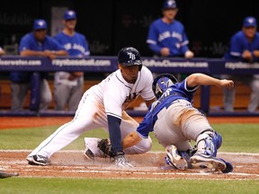 Tampa Bay Rays' Desmond Jennings slides safe into home plate as Toronto Blue Jays' Josh Thole attempts to tag him out during the fifth inning at Tropicana Field. (Kim Klement/USA TODAY Sports)