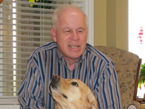 Mike Davidson at home with his dog, Chloe.