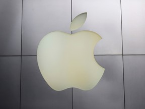 The Apple logo is pictured at its flagship retail store in San Francisco, Jan. 27, 2014. REUTERS/Robert Galbraith