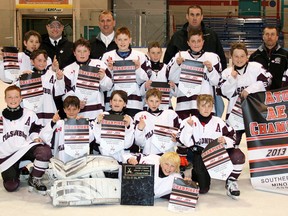 Tillsonburg Hogarth Insurance AE atoms celebrate their 2014 Southern Counties A championship Sunday in Simcoe. CONTRIBUTED PHOTO