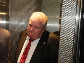 Mayor Rob Ford arrives at City Hall around 1 p.m. on Thursday. (CRAIG ROBERTSON/Toronto Sun)