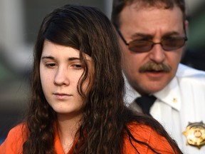 Miranda Barbour, 19, the woman dubbed the so-called Craigslist killer suspect, is led into court by sheriff deputies in Sunbury, Pennsylvania April 1, 2014. (REUTERS/Mark Makela)