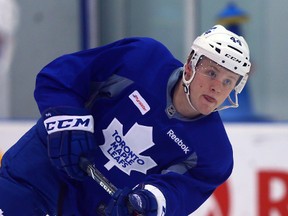 Maple Leafs rookie Morgan Rielly says players can't get caught up in what people outside the dressing room are saying about the team. (QMI AGENCY)