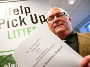 FILE: Don Belanger, the program manager for Capital City Clean Up, holds the 2013 Litter Audit report. Ian Kucerak/Edmonton Sun