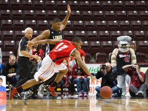 Express?s Darren Duncan drives past London Lightning?s Jermaine Johnson during Game 7 of their NBL of Canada semifinal at the WFCU Centre in Windsor on Tuesday. (CRAIG GLOVER/The London Free Press)