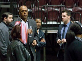 NBL Canada commissioner Paul Riley, second from left, and Windsor Express co-owner Dartis Willis, second from right, glance over at London Free Press sports reporter Morris Dalla Costa after deciding to eject the reporter from the WFCU Centre as London Lightning general manager Taylor Brown, right, stands to the side in Windsor, Ontario on Tuesday April 1, 2014.  Dalla Costa was not given a reason for his ejection, but was the only member of the media told to leave.
CRAIG GLOVER/The London Free Press/QMI Agency