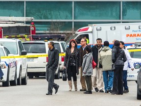 People leave the Davis Courthouse in Brampton a few hours  after  Const. Mike Klarenbeek was shot inside the building last Friday. (ERNEST DOROSZUK, Toronto Sun)