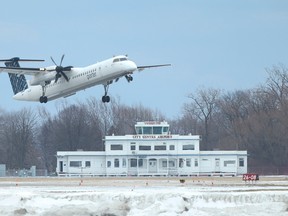 A Porter Airlines plane takes off recently from Billy Bishop airport. (JACK BOLAND, Toronto Sun)