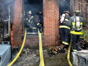Firefighters mop up after battling a nine-alarm blaze in Boston's Back Bay neighborhood March 26. Two firefighters were killed and at least 17 people injured as fire raced through a four-story building drawing a large-scale emergency response.  
REUTERS/Boston Fire Department via Twitter