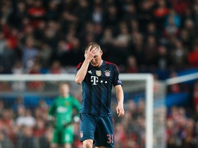 Bayern Munich's Bastian Schweinsteiger reacts after he was sent off during their Champions League quarterfinal match against Manchester United at Old Trafford in Manchester, April 1, 2014. (REUTERS/Stefan Wermuth)