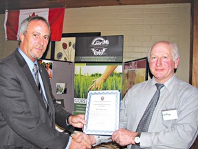 Chatham-Kent Mayor Randy Hope presents a certificate to Jacques Tetreault, president of the Christian Farmers Association of Chatham-Kent- Essex, in recognition of the group's contributions to the municipality. The presentation was made as the local group marked the 60th anniversary of the Christian Farmers Federation of Ontario at its annual meeting.