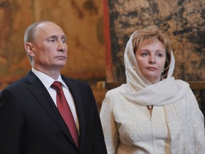 Vladimir Putin (L) and his wife, Lyudmila, attend a service, conducted by the Patriarch of Moscow and All Russia Kirill, to mark the start of his term as Russia's new president at the Kremlin in Moscow in this May 7, 2012 file photo.  (REUTERS/Aleksey Nikolskyi/RIA Novosti/Pool/Files)