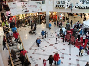 Christmas shoppers take over the St. Laurent Centre last December. with business booming, ownership has to decided to put expansion plans on hold. Ottawa Sun file photo