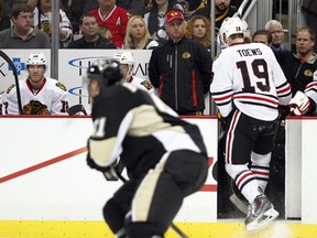 Jonathan Toews #19 of the Chicago Blackhawks skates off the ice after being checked into the corner by Brooks Orpik #44 of the Pittsburgh Penguins (not pictured) in the second period during the game at Consol Energy Center on March 30, 2014 in Pittsburgh, Pennsylvania. (Justin K. Aller/Getty Images/AFP)