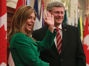 MP Eve Adams waves to caucus as she is met by Prime Minister Stephen Harper at the first National Caucus at Parliament Hill in this June 1, 2011 file photo. (QMI Agency files)