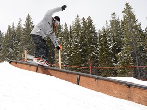 A rider hits a rail at Castle Mountain on one of the last days of the 2013/14 season. John Stoesser photo/QMI Agency.