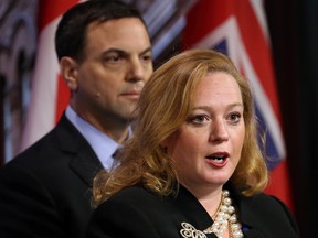 Ontario Progressive Conservative leader Tim Hudak along with energy critic Lisa MacLeod address media at Queen Park on March 27, 2014. (Michael Peake/Toronto Sun)