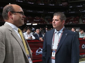 Boston Bruins general manager Peter Chiarelli (left) and the Maple Leafs' Dave Nonis talk during the 2013 NHL Draft. ( Bruce Bennett/Getty Images/AFP)