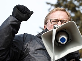 David Eggen, NDP MLA for Edmonton-Calder, speaks during a demonstration outside of St. Thomas Health Centre in Edmonton, Alta., on Wednesday, April 2, 2014. The AUPE and other organizations protested outsourcing at the facility. Over 100 members of the AUPE work at the facility. Ian Kucerak/Edmonton Sun/QMI Agency