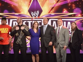 Hulk Hogan, Randy Orton, Stephanie McMahon, Triple H, John Cena and Daniel Bryan attend the WrestleMania 30 press conference at the Hard Rock Cafe New York on April 1, 2014 in New York City.  (Dimitrios Kambouris/Getty Images/AFP)