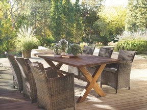 The over-sized harvest table comes in a teak finish that can be stained or left to weather. Either way, it pairs well with woven, resin wicker chairs.