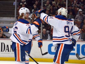 Edmonton Oilers' Philip Larsen (36) is congratulated by Ryan Smyth (94) after a goal in the second period against the Anaheim Ducks at Honda Center on Wed., April 2. (Kirby Lee-USA TODAY)