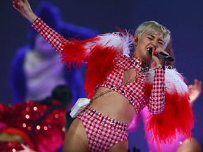 Miley Cyrus performs at the Air Canada Centre in Toronto, Ont. on Monday March 31, 2014. (Dave Abel/Toronto Sun/QMI Agency)