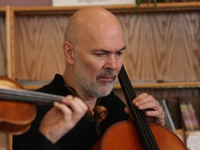 JOHN LAPPA/THE SUDBURY STAR
Dick van Raadshooven, of the Sudbury Symphony String Quartet, performs at the main branch of the Greater Sudbury Public Library in this file photo