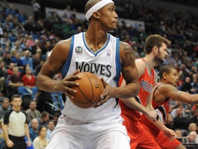 Minnesota Timberwolves forward Dante Cunningham (33) brings down a rebound in the first quarter at Target Center on Feb. 8. (Marilyn Indahl-USA TODAY Sports)