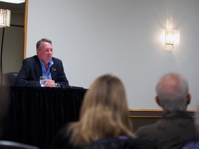 Pat Stier listens on during his reverse town hall at the Heritage Inn  as one of his constituents brings forth the issue of solar energy in Southern Alberta. Greg Cowan photo/QMI Agency.