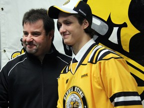 Nikita Korostelev, right, the Sarnia Sting's first round draft pick in the 2013 OHL Priority Selection, shakes hands with former Sting head coach and general manager Jacques Beaulieu after being introduced to the media Thursday, April 11, 2013 at the RBC Centre in Sarnia, Ont. OBSERVER FILE PHOTO