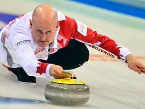 Canada's skip Kevin Koe delivers a stone in a match against Scotland during the World Men's Curling Championships, in Beijing, April 3, 2014. REUTERS/China Daily