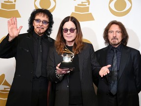Musicians Tony Iommi, Ozzy Osbourne and Geezer Butler of Black Sabbath (L-R) pose with their award for Best Metal Performance for "God is Dead?" at the 56th annual Grammy Awards in Los Angeles, California January 26, 2014. (REUTERS/Lucy Nicholson)