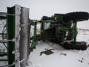 RCMP arrested a man after this tractor rolled near Blackfalds on April 2, 2014. RCMP were first called to a break-in, and then a tractor theft. A Mountie followed the tractor on the back of a snowmobile until it rolled down a hill. RCMP handout photo