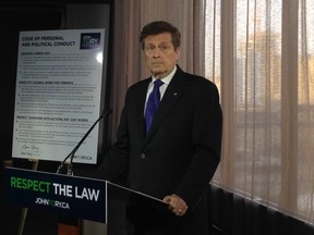 Mayoral candidate John Tory unveils a code of conduct which her vows to live by. (DON PEAT/Toronto Sun)