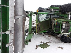 RCMP arrested a man after this tractor rolled near Blackfalds, Alta., on April 2, 2014. (RCMP handout/QMI Agency)
