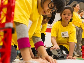 Angelia Pan (left), Sajim Jayasena, and Judy Gau, are Grade 4 students from Bayridge Public School. They competed at their first Lego Robotics skills competition at St. Lawrence College, in Kingston. The event was hosted by the Limestone District School Board. 
BRIANNE STE MARIE LACROIX/KINGSTONWHIG_STANDARD/QMIAGENCY