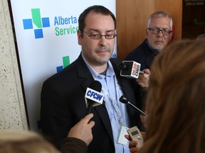 Alberta Health Services (AHS) Dr. Christopher Sikora, Edmonton zone medical officer of health, speaks to media on Thursday, April 3, 2014 responding to a confirmed case of the measles in Edmonton. The latest case brings the provincial total to nine this year, compared to 44 cases in 2013. Trevor Robb/Edmonton Sun