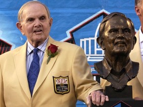 The widow of Ralph Wilson Jr., seen here posing with his bust at the Pro Football Hall of Fame in Canton, Ohio August 8, 2009 has taken over control of the Buffalo Bills. (REUTERS/Ron Kuntz/Files)