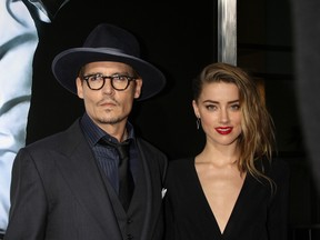 Johnny Depp and Amber at the Heard 3 Days to Kill LA Premiere in Los Angeles, California, United States on February 13, 2014. (Nikki Nelson/WENN.com)