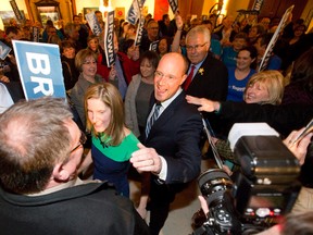 Mayoral candidate Matt Brown and his wife, Andrea, greet supporters as they make their way through the crowd during his campaign kickoff at Aeolian Hall in London Thursday.