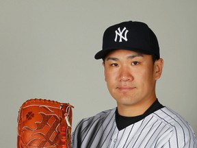 New York Yankees starting pitcher Masahiro Tanaka (19) poses for a photo at Steinbrenner Field on Feb. 22, 2014. (KIM KLEMENT/USA TODAY Sports)