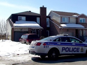 A Ottawa police cruiser sits outside the home of Chris Hoare.